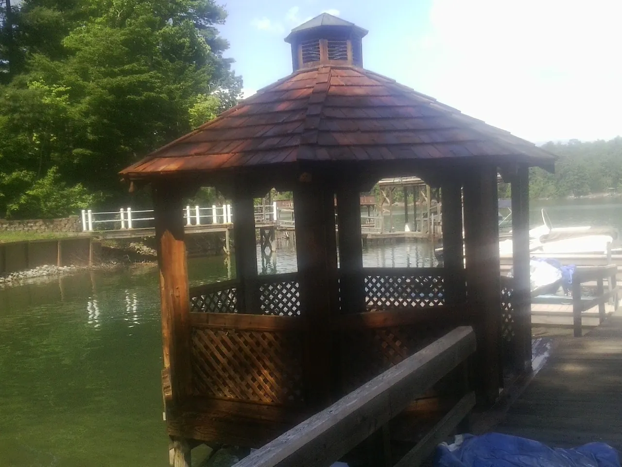 Cedar shake gazebo roof rebuilt on a lake dock in Johnstown